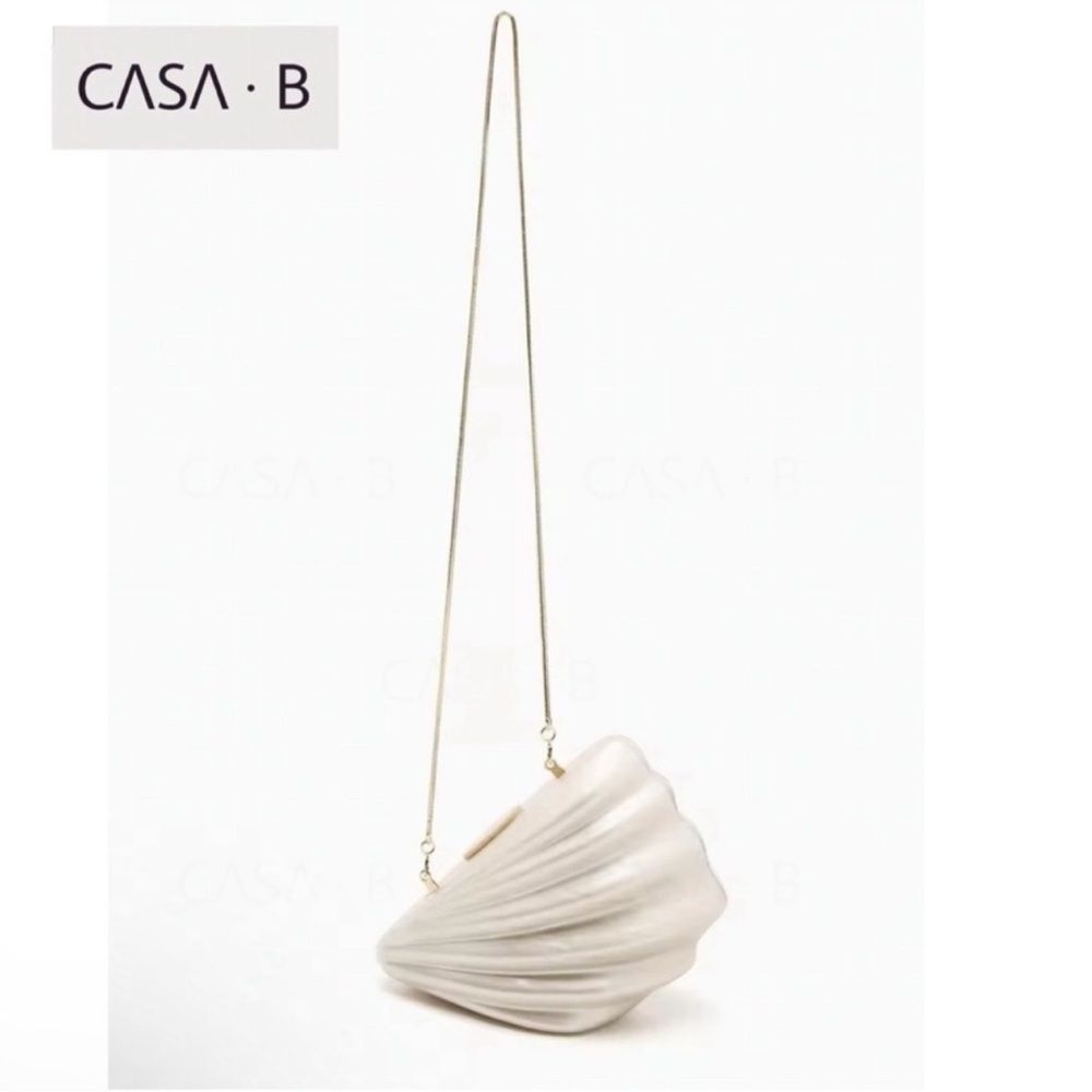 SOON to CASA B| The Celestial Marina Clutch 
Elegant Cream Shell Crossbody Bag